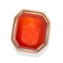 A CARNELIAN INTAGLIO RING set with a carnelian intaglio carved to depict a family crest, no assay...