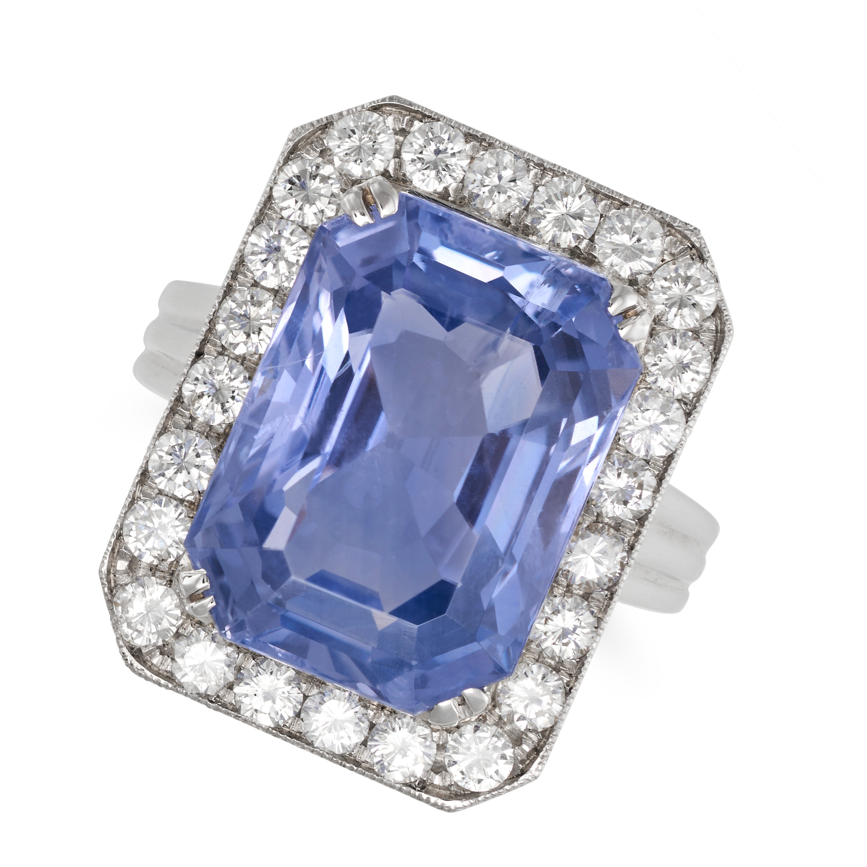 A CEYLON NO HEAT SAPPHIRE AND DIAMOND CLUSTER RING in white gold, set with an octagonal step cut ...