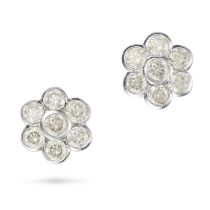 A PAIR OF DIAMOND CLUSTER EARRINGS each set with a cluster of round brilliant cut diamonds, the d...
