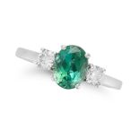A GREEN TOURMALINE AND DIAMOND THREE STONE RING set with an oval cut green tourmaline accented on...