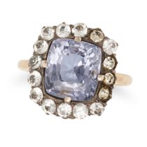 A SPINEL AND PASTE CLUSTER RING set with a cushion cut spinel of approximately 4.10 carats in a c...