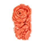 NO RESERVE - A CORAL CLIP BROOCH set with a coral carved to depict a rose and lily of the valley,...