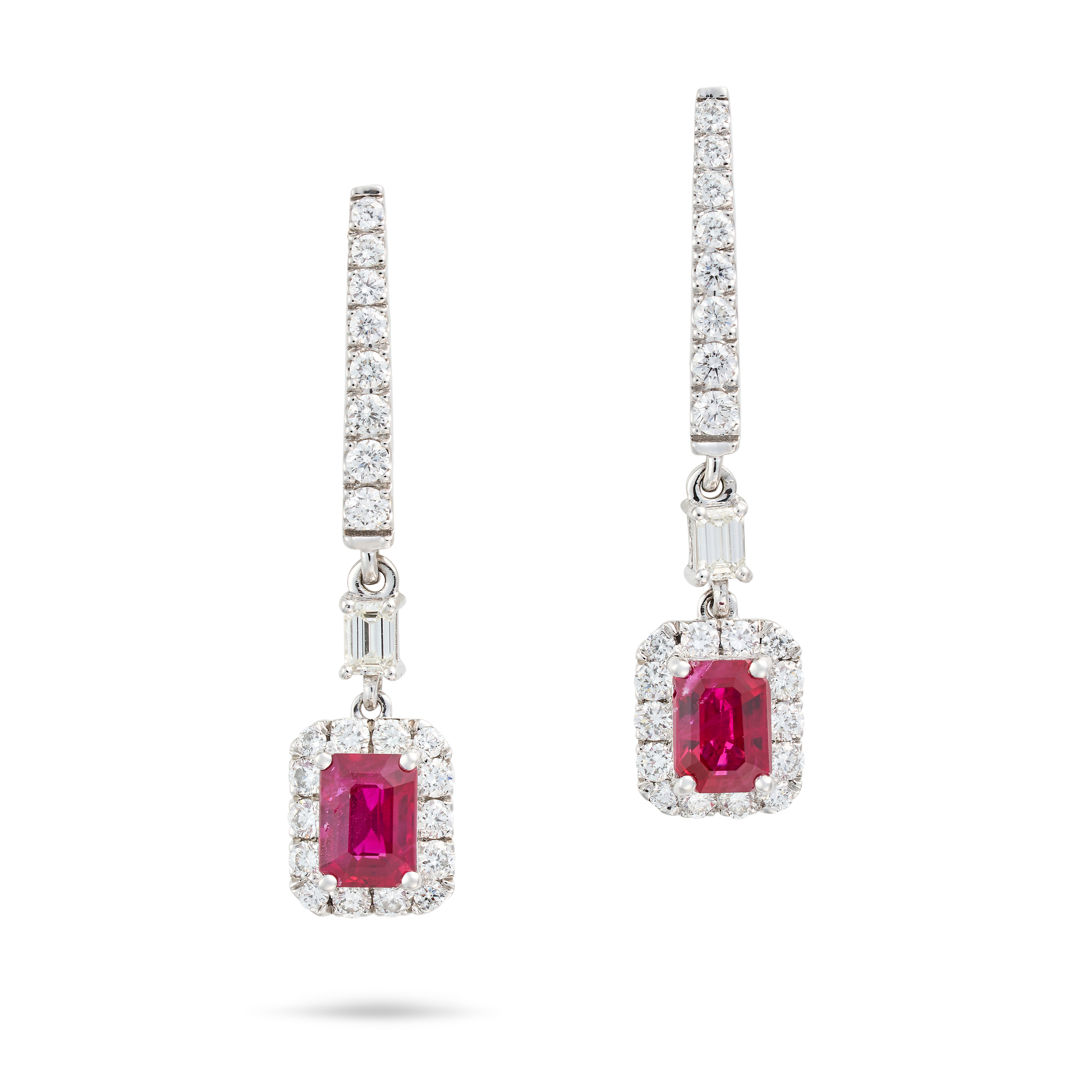 A PAIR OF BURMESE RUBY AND DIAMOND DROP EARRINGS each comprising a row of round brilliant and bag...