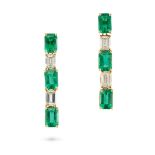 A PAIR OF EMERALD AND DIAMOND DROP EARRINGS each comprising a row of alternating octagonal step c...