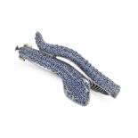 A SAPPHIRE SNAKE BANGLE the hinged bangle designed as a coiled snake set with round cabochon sapp...