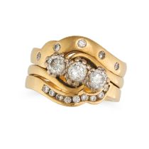 THREE DIAMOND STACKING RINGS in 18ct yellow gold, comprising a three stone diamond ring and two c...