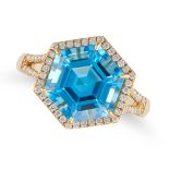A BLUE TOPAZ AND DIAMOND RING set with an hexagonal step cut blue topaz of 5.34 carats in a borde...
