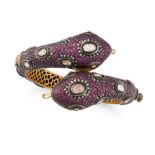 A RUBY AND DIAMOND SNAKE BANGLE the hinged bangle designed as a double headed snake, set througho...