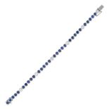 A SAPPHIRE AND DIAMOND LINE BRACELET comprising a row of round cut sapphires punctuated by round ...