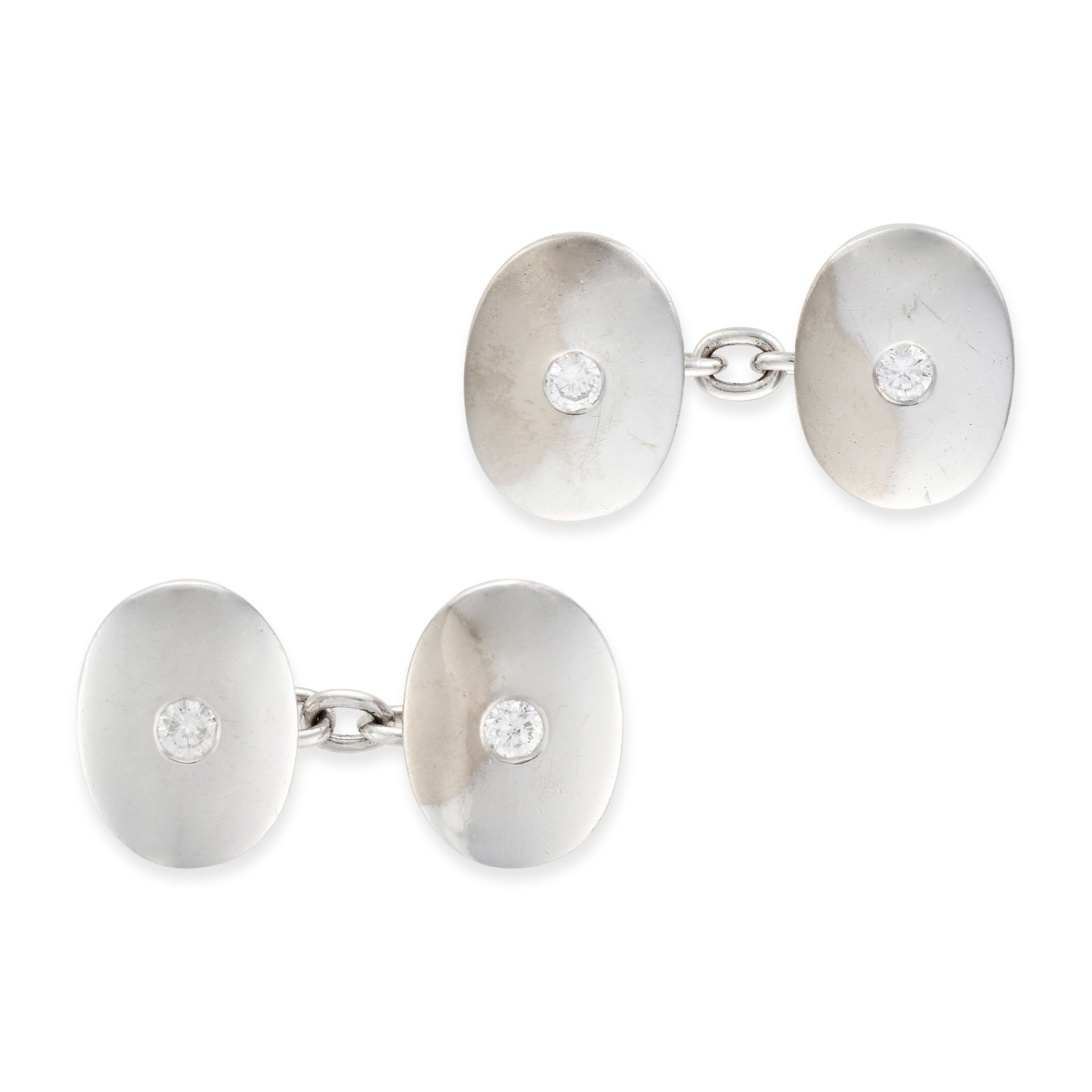A PAIR OF DIAMOND CUFFLINKS each oval link set with a round brilliant cut diamond, stamped 18, ea...