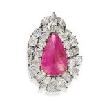 A BURMA NO HEAT RUBY AND DIAMOND BROOCH / PENDANT set with a pear shaped fancy cut ruby of 20.91 ...