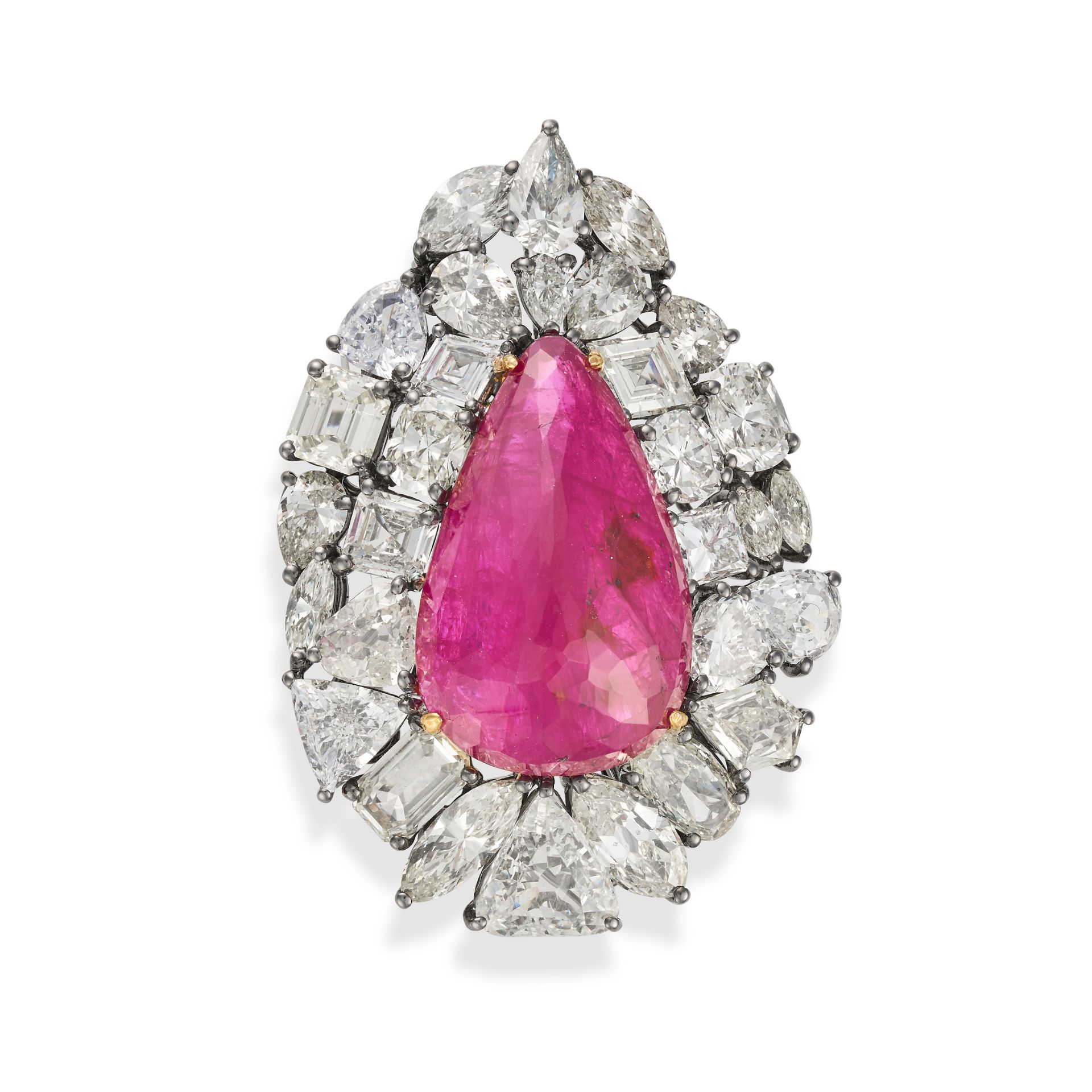 A BURMA NO HEAT RUBY AND DIAMOND BROOCH / PENDANT set with a pear shaped fancy cut ruby of 20.91 ...