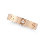 CARTIER, A DIAMOND LOVE RING in 18ct rose gold, the band punctuated by screw head motifs, accente...