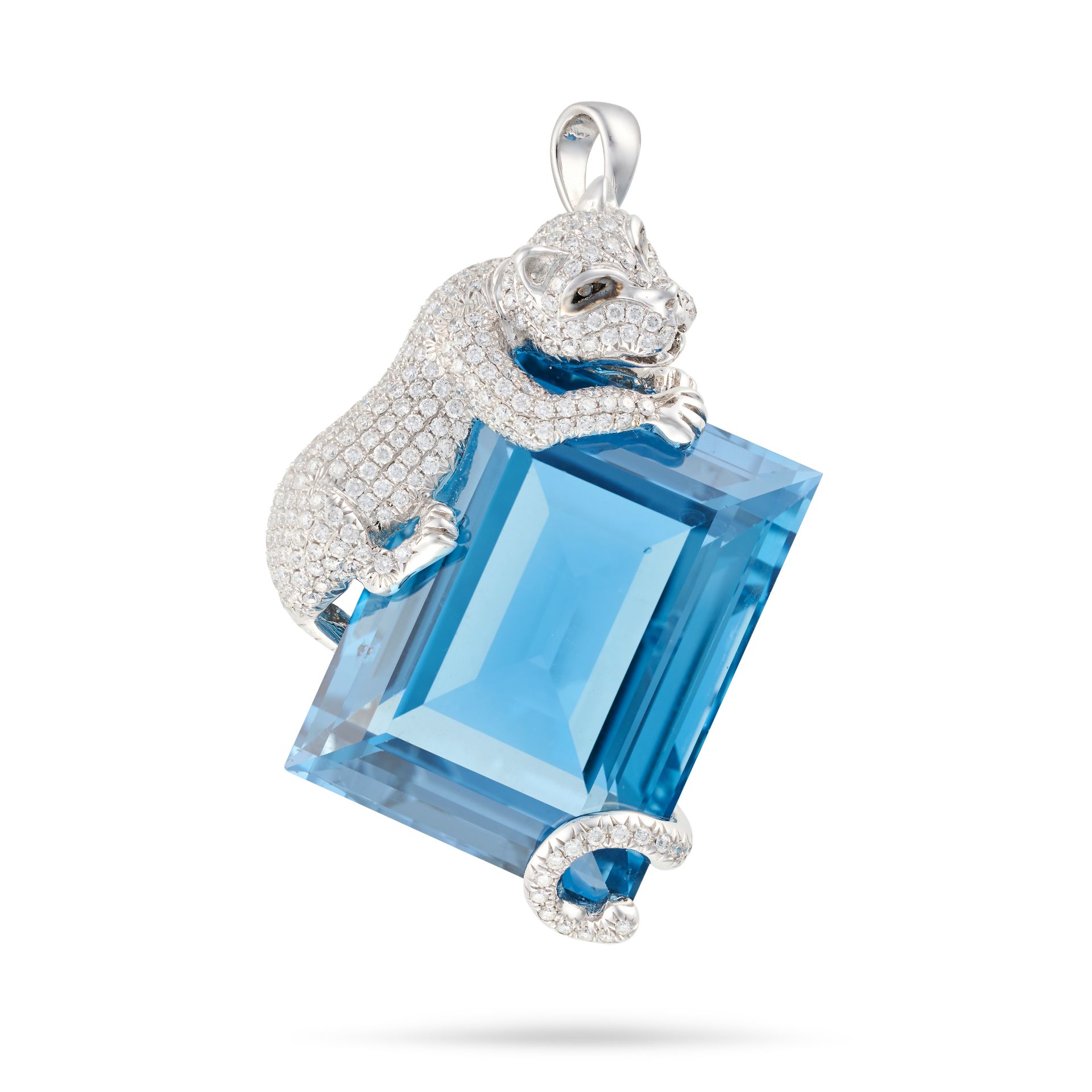 A BLUE TOPAZ AND DIAMOND PANTHER PENDANT set with a rectangular step cut blue topaz of approximat...