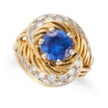 A SAPPHIRE AND DIAMOND DRESS RING set with a round cut sapphire of approximately 1.89 carats, acc...