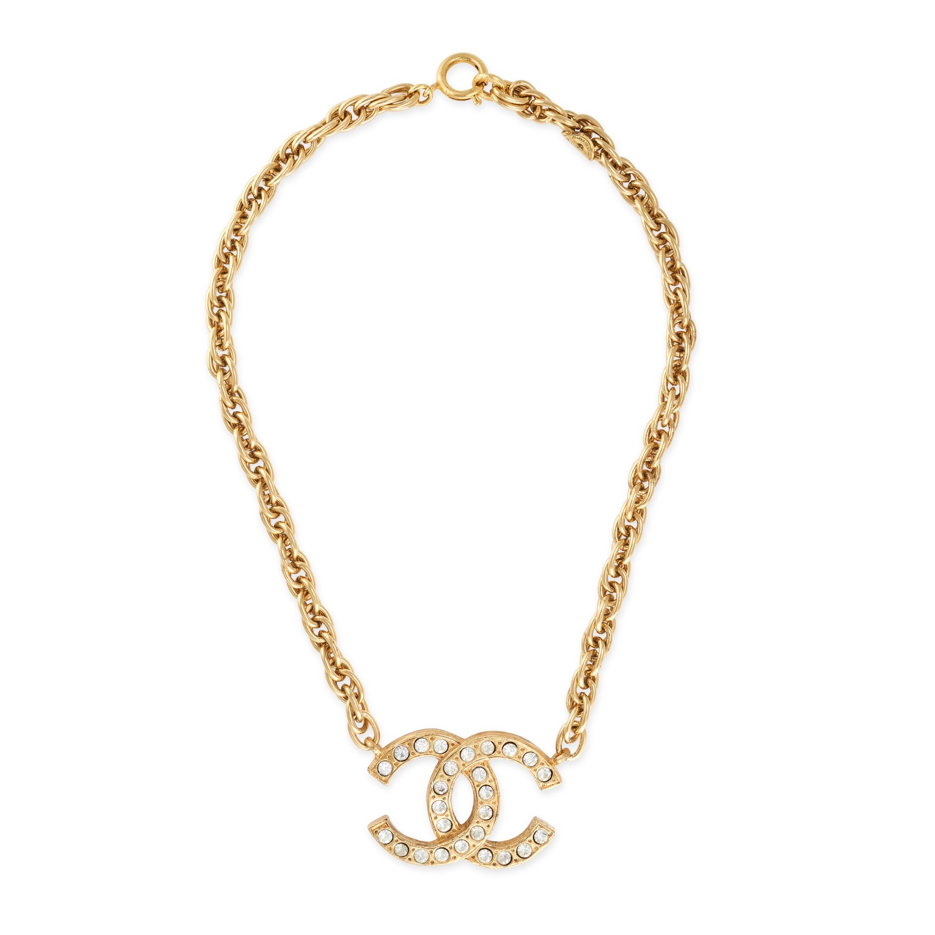 CHANEL, A CRYSTAL CC PENDANT AND CHAIN comprising a crystal embellished pendant with interlocking...