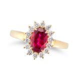 A RUBELLITE TOURMALINE AND DIAMOND CLUSTER RING set with an oval cut rubellite tourmaline of 1.23...