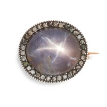 AN ANTIQUE STAR SAPPHIRE AND PASTE BROOCH in yellow gold and silver, set with a cabochon star sap...