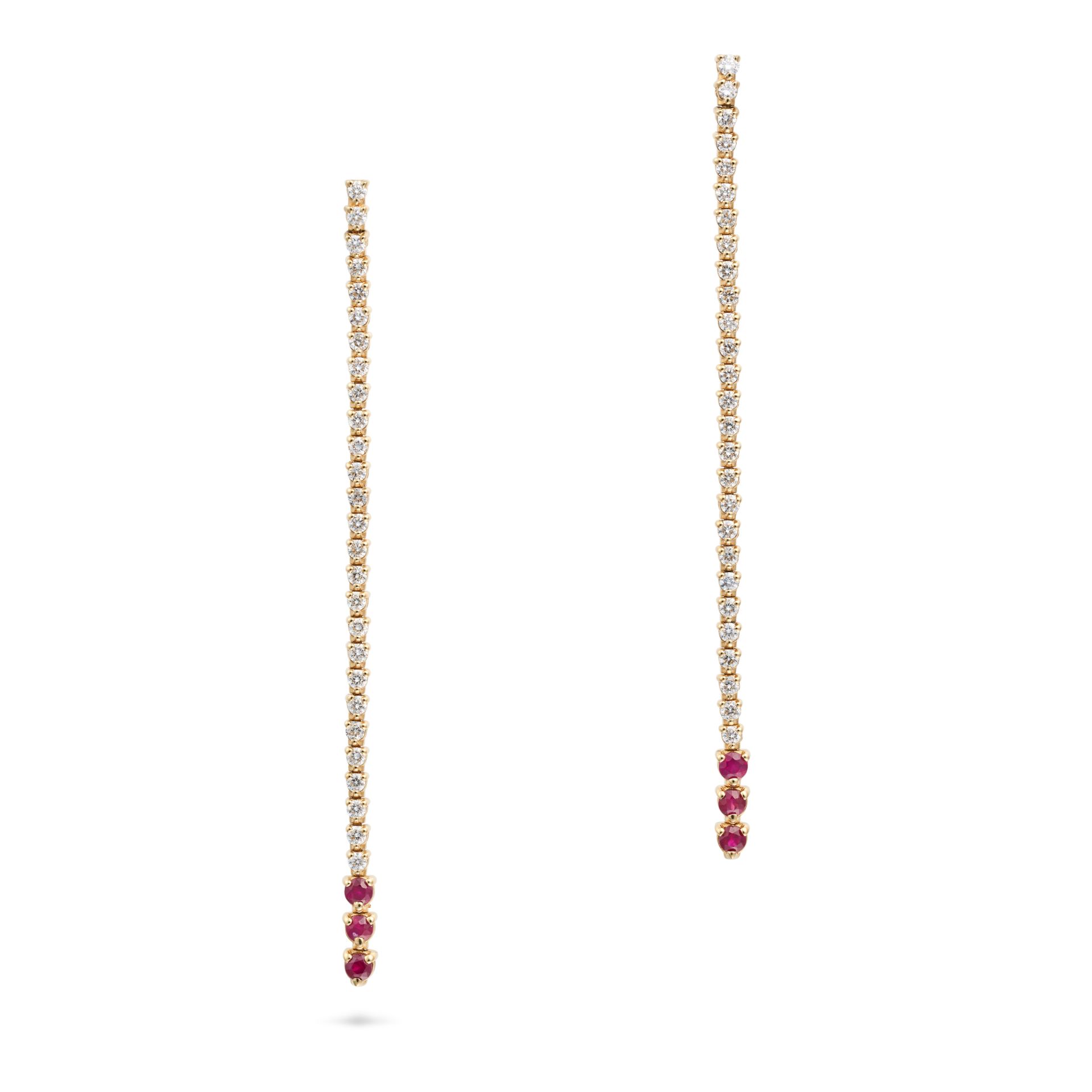 A PAIR OF RUBY AND DIAMOND DROP EARRINGS each comprising a row of round brilliant cut diamonds an...