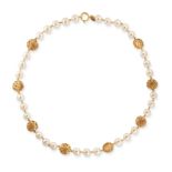 CHANEL, A FAUX PEARL AND CC NECKLACE in gold plated metal, set with faux pearls alternating with ...