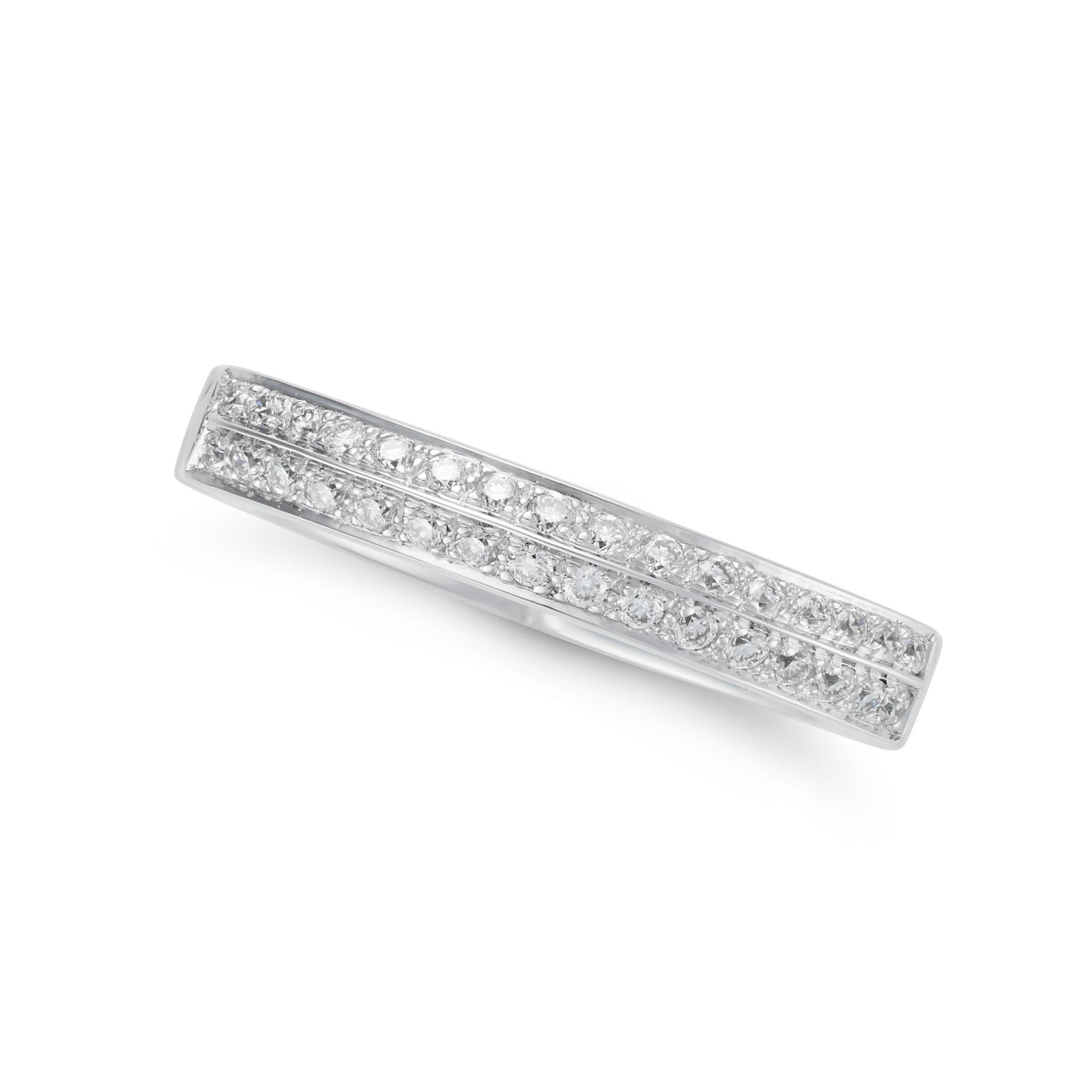 STEPHEN WEBSTER, A DIAMOND HALF ETERNITY RING in 18ct white gold, the stylised band pave set with...