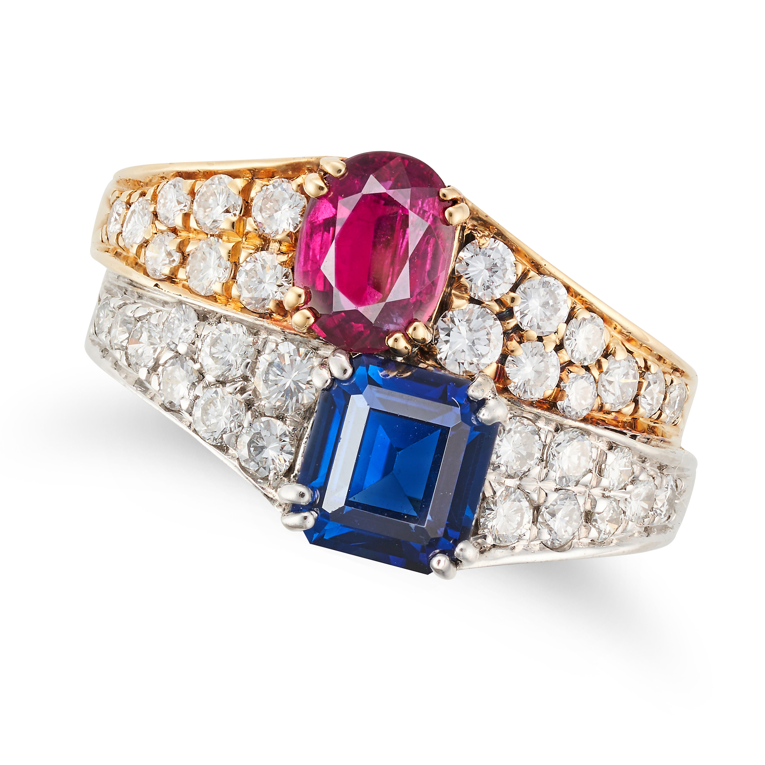 A RUBY, SAPPHIRE AND DIAMOND DRESS RING set with an octagonal step cut sapphire and oval cut ruby...