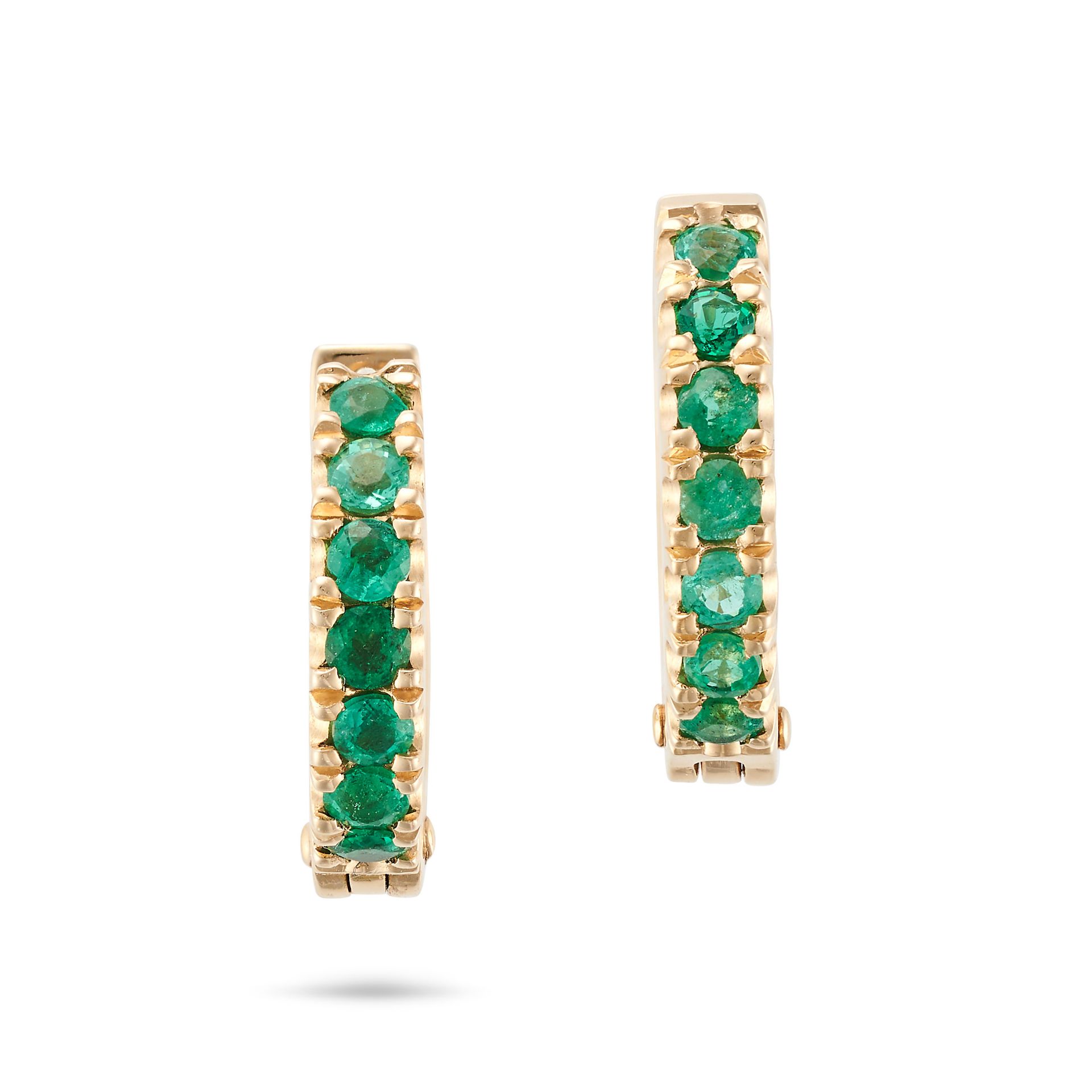 A PAIR OF EMERALD HUGGIE HOOP EARRINGS each set with a row of round cut emeralds, stamped 18K, 1....