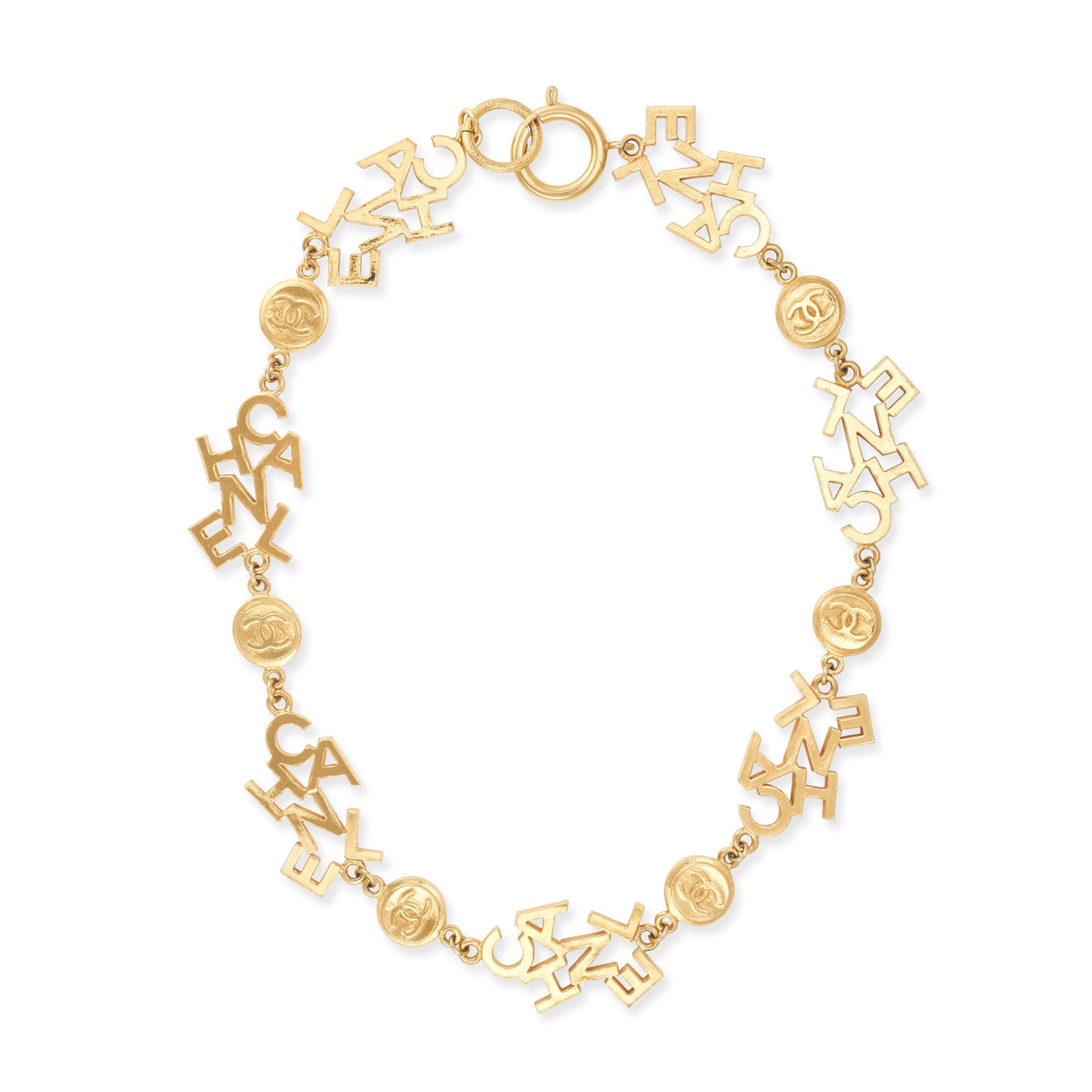 CHANEL, A VINTAGE NECKLACE comprising a row of fancy links each spelling Chanel, alternating with...