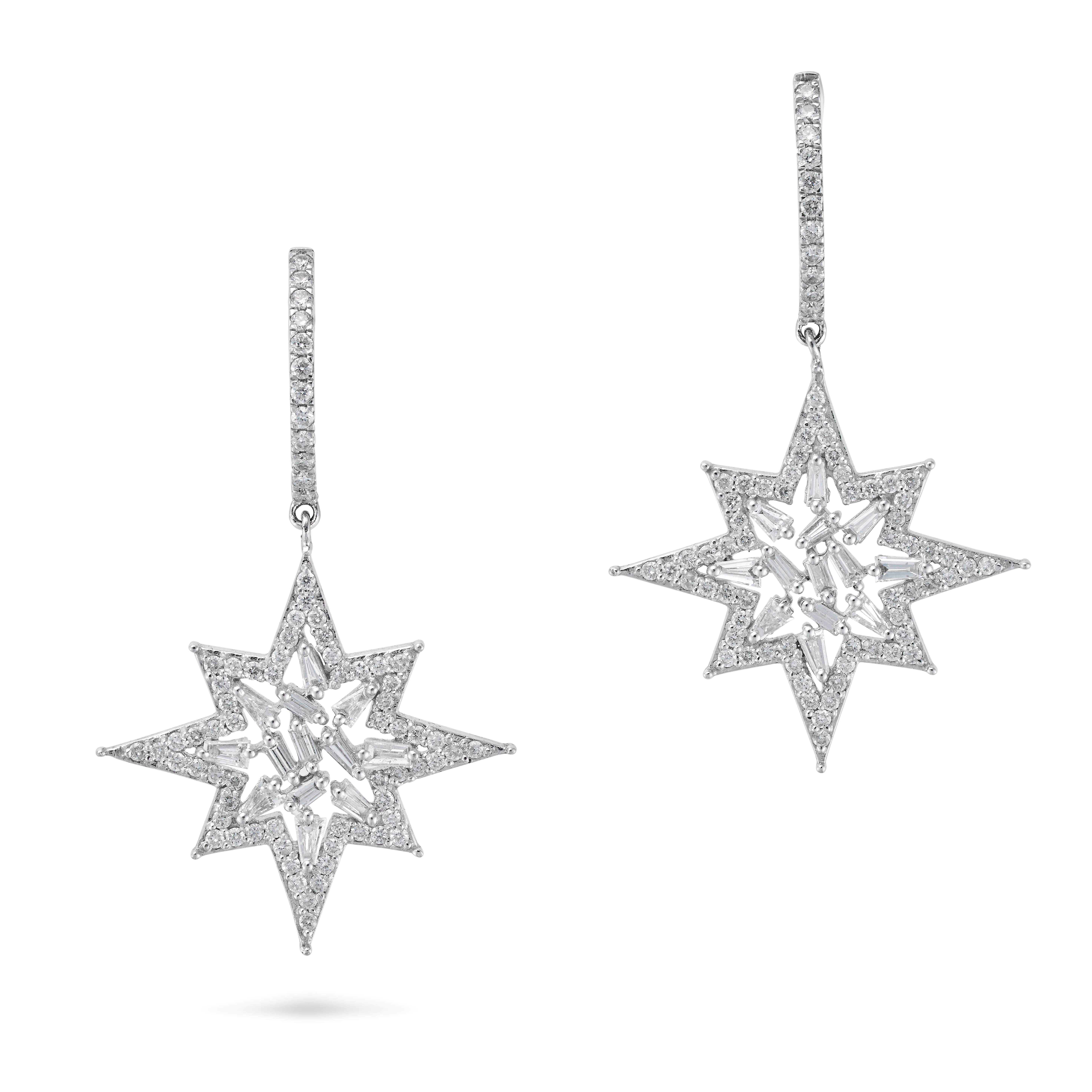 A PAIR OF DIAMOND STAR DROP EARRINGS each designed as a hoop set with a row of round cut diamonds...