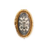 AN ANTIQUE GEORGIAN OUROBOROS MOURNING BROOCH the oval brooch set with needlework beneath a glass...