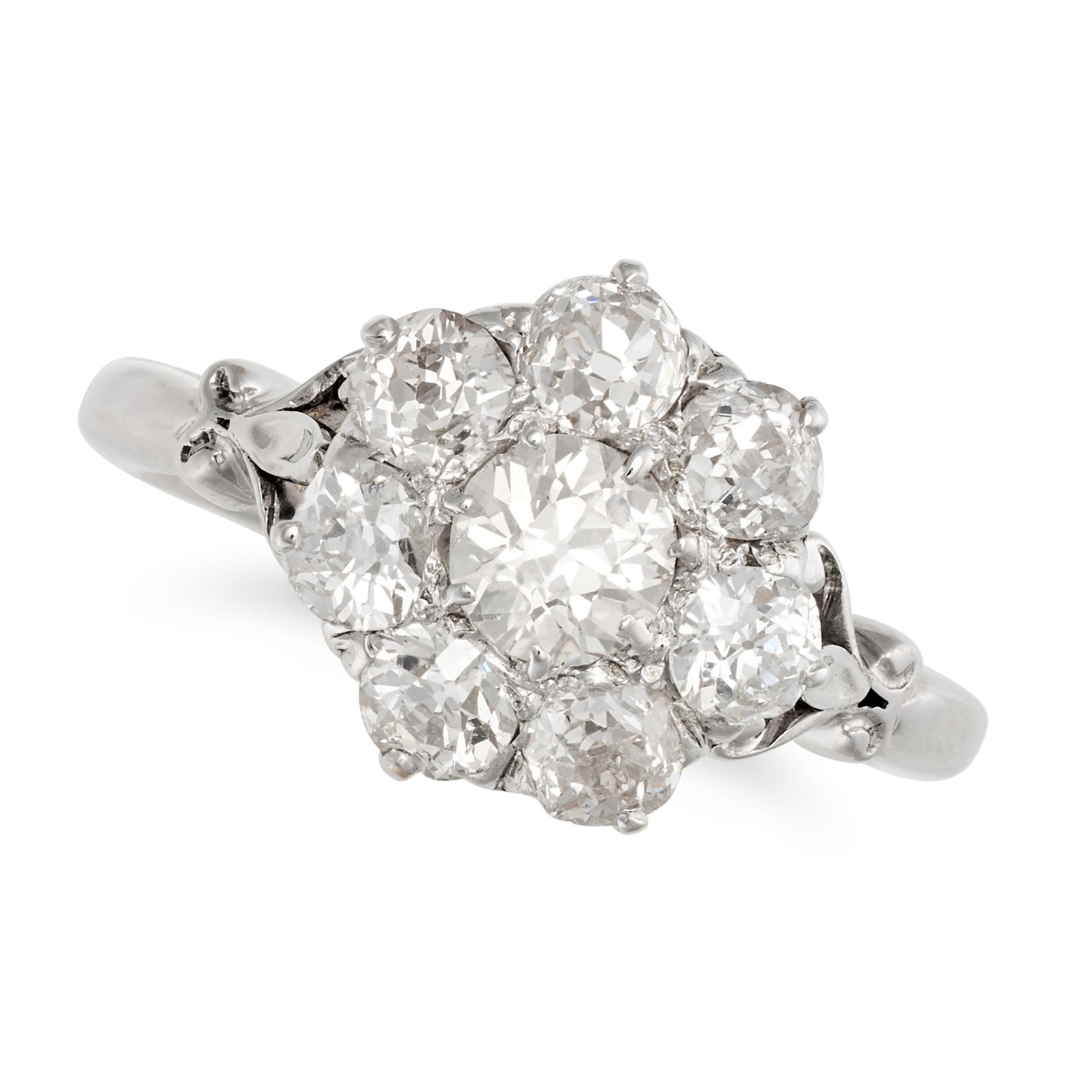 A DIAMOND CLUSTER RING set with a cluster of old European cut diamonds, the diamonds all totallin...