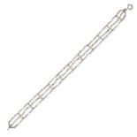 A PEARL AND DIAMOND BRACELET in white gold, comprising three rows of trace chain set with seed pe...