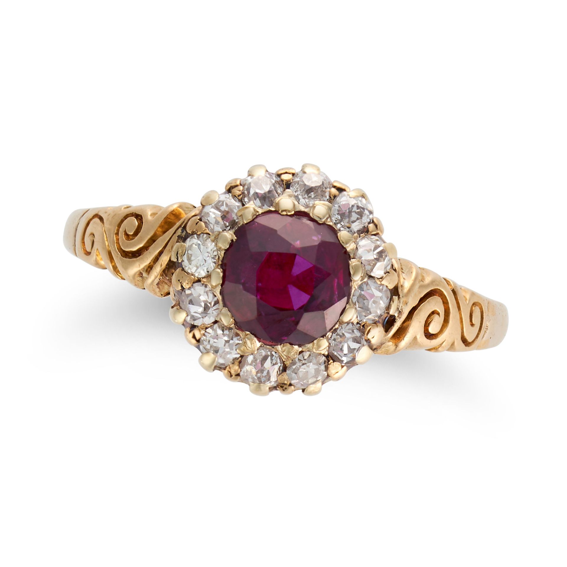 A RUBY AND DIAMOND CLUSTER RING set with a round cut ruby in a cluster of old and round cut diamo...