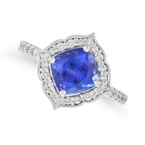 A TANZANITE AND DIAMOND RING set with a cushion cut tanzanite of approximately 2.35 carats in a b...