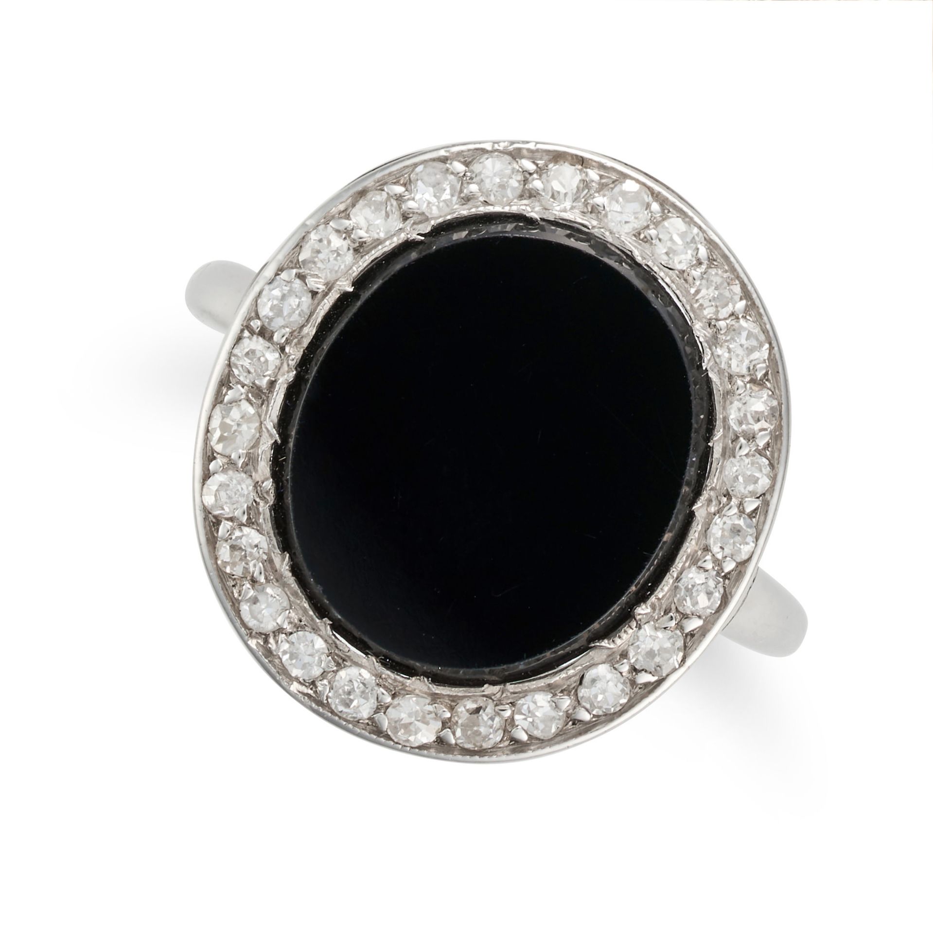 NO RESERVE - AN ONYX AND DIAMOND RING set with an oval polished onyx in a border of old and round...