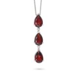 A GARNET AND DIAMOND NECKLACE set with a row of three pear cut garnets, accented by two round cut...