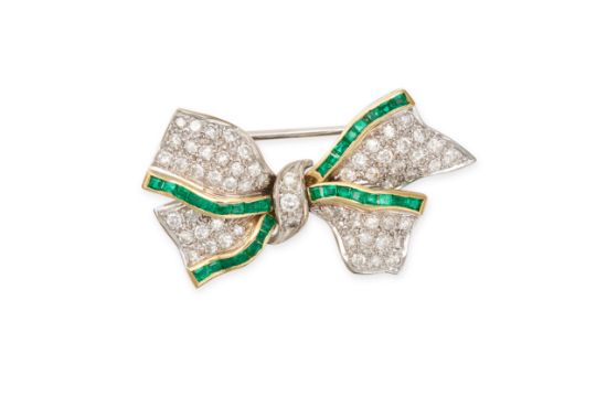 A VINTAGE EMERALD AND DIAMOND BOW BROOCH in 18ct white and yellow gold, designed as a ribbon tied...