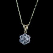 AN 18 CARAT YELLOW GOLD AND DIAMOND FLOWER HEAD CLUSTER PENDANT