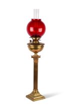 A LATE VICTORIAN BRASS CORINTHIAN COLUMN OIL LAMP