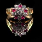 AN 18 CARAT YELLOW GOLD DIAMOND AND RUBY DRESS RING