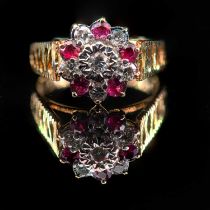 AN 18 CARAT YELLOW GOLD DIAMOND AND RUBY DRESS RING