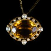A VICTORIAN YELLOW TOPAZ AND PEARL OVAL BROOCH / PENDANT