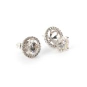 A PAIR OF 18 CARAT WHITE GOLD AND DIAMOND STUD EARRINGS