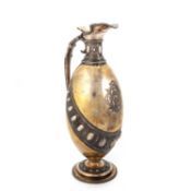 A VICTORIAN SILVER AND SILVER-GILT WINE EWER