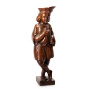 A 19TH CENTURY CARVED OAK FIGURE OF A HORNBLOWER