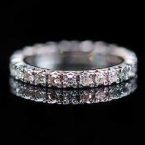 A PLATINUM AND DIAMOND ETERNITY RING