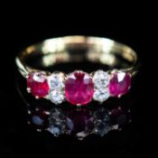 AN 18 CARAT YELLOW GOLD RUBY AND DIAMOND RING
