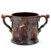 A LARGE 19TH CENTURY TREACLE GLAZE LOVING CUP