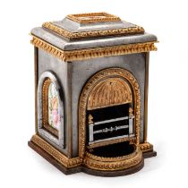 A MINIATURE STEEL AND GILT-METAL SALESMAN SAMPLE FIREPLACE