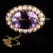 A VICTORIAN STYLE YELLOW GOLD, AMETHYST AND SEED PEARL OVAL BROOCH